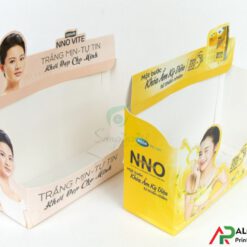 In hộp giấy mỹ phẩm màu vàng và kem